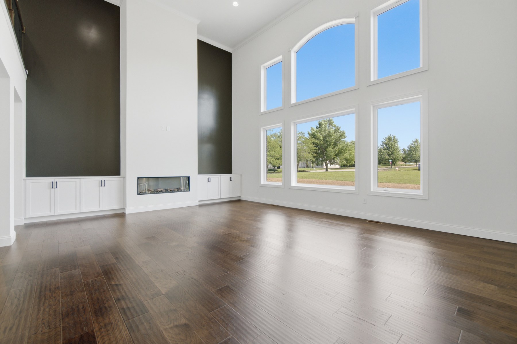 Empty living room with bare walls and no furniture