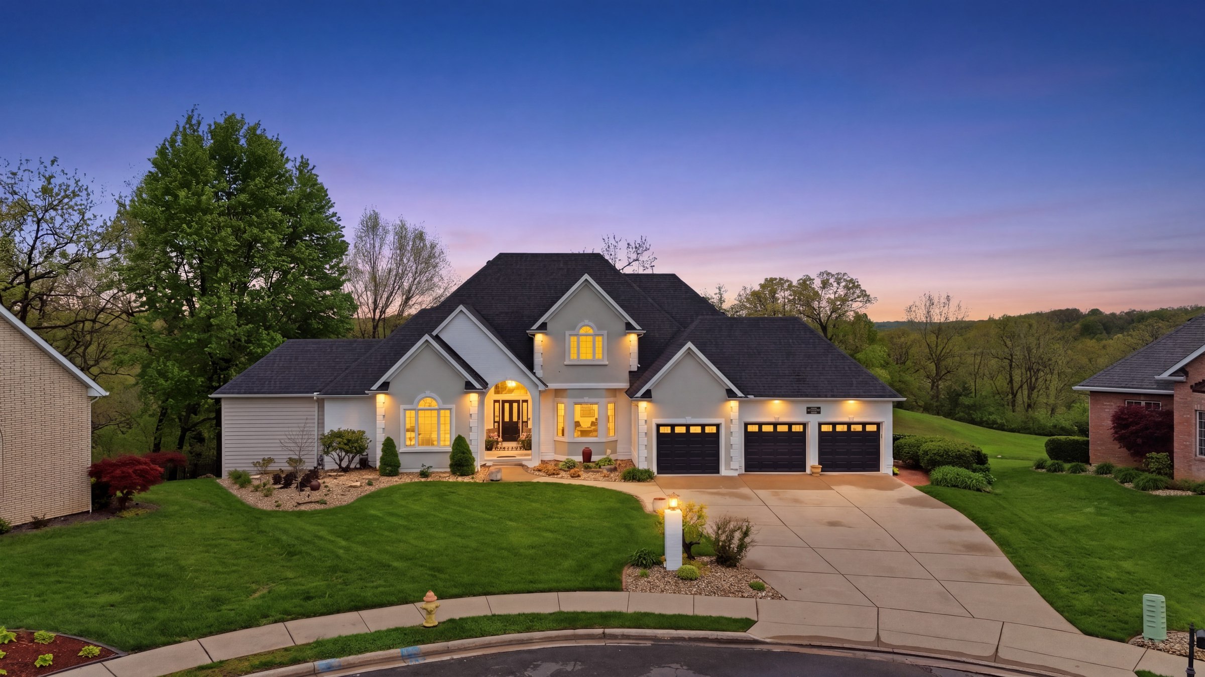 Twilight exterior photograph of a home